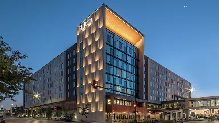 Photo: Evening exterior of Hilton Des Moines Downtown hotel.
